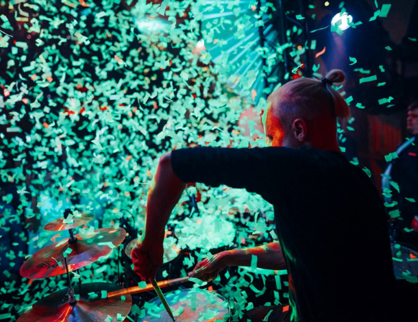 Drummer Siim Koppel playing drums at the event